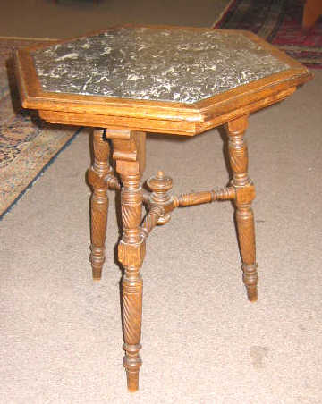 Appraisal: CONTINENTAL TH CENTURY OAK CENTER TABLE With hexagonal grey veined