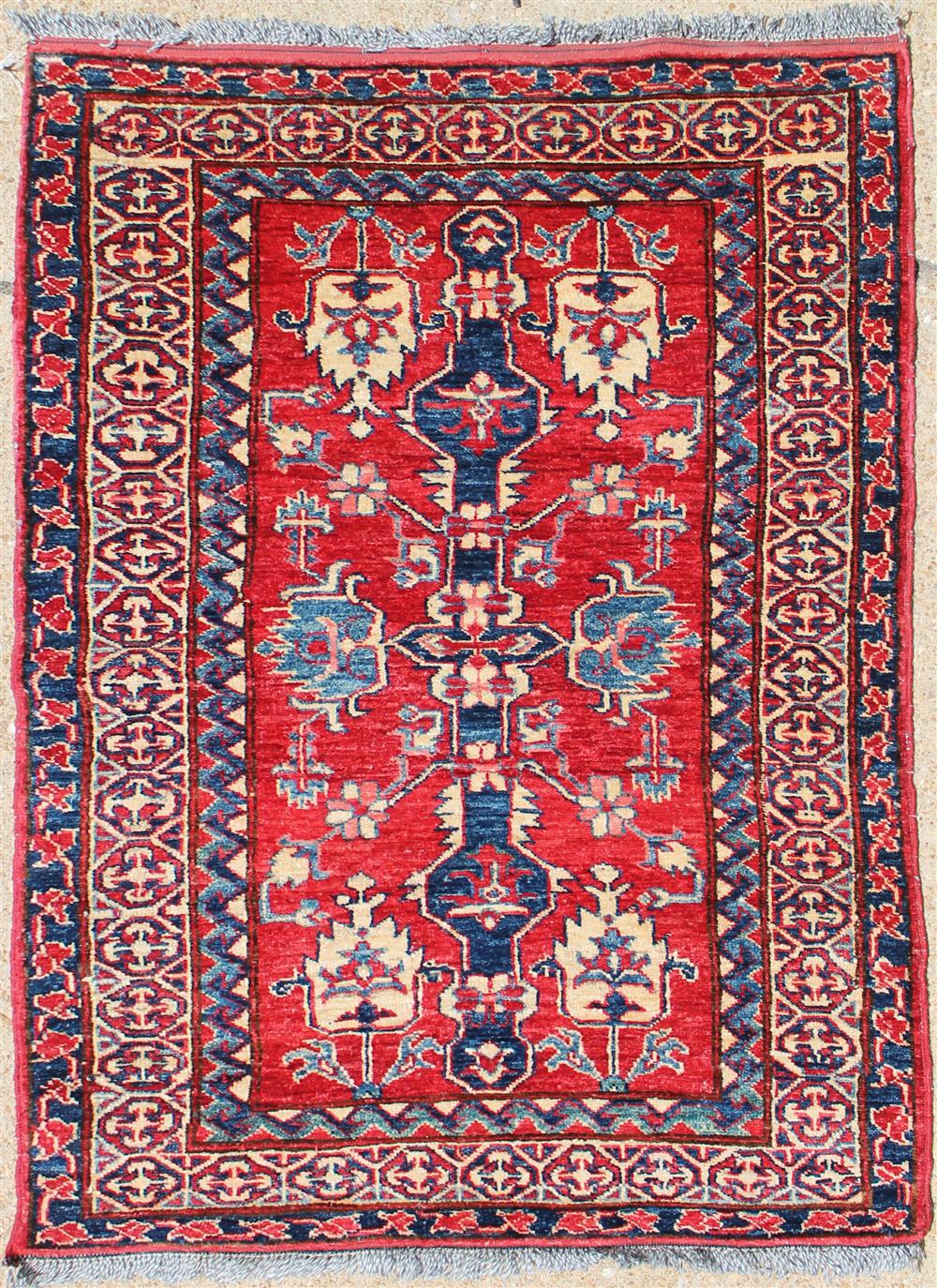 Appraisal: TRIBAL SILK RUG pinks reds blues cream on a central