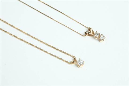 Appraisal: TWO DIAMOND PENDANT NECKLACES One with solitaire on a K