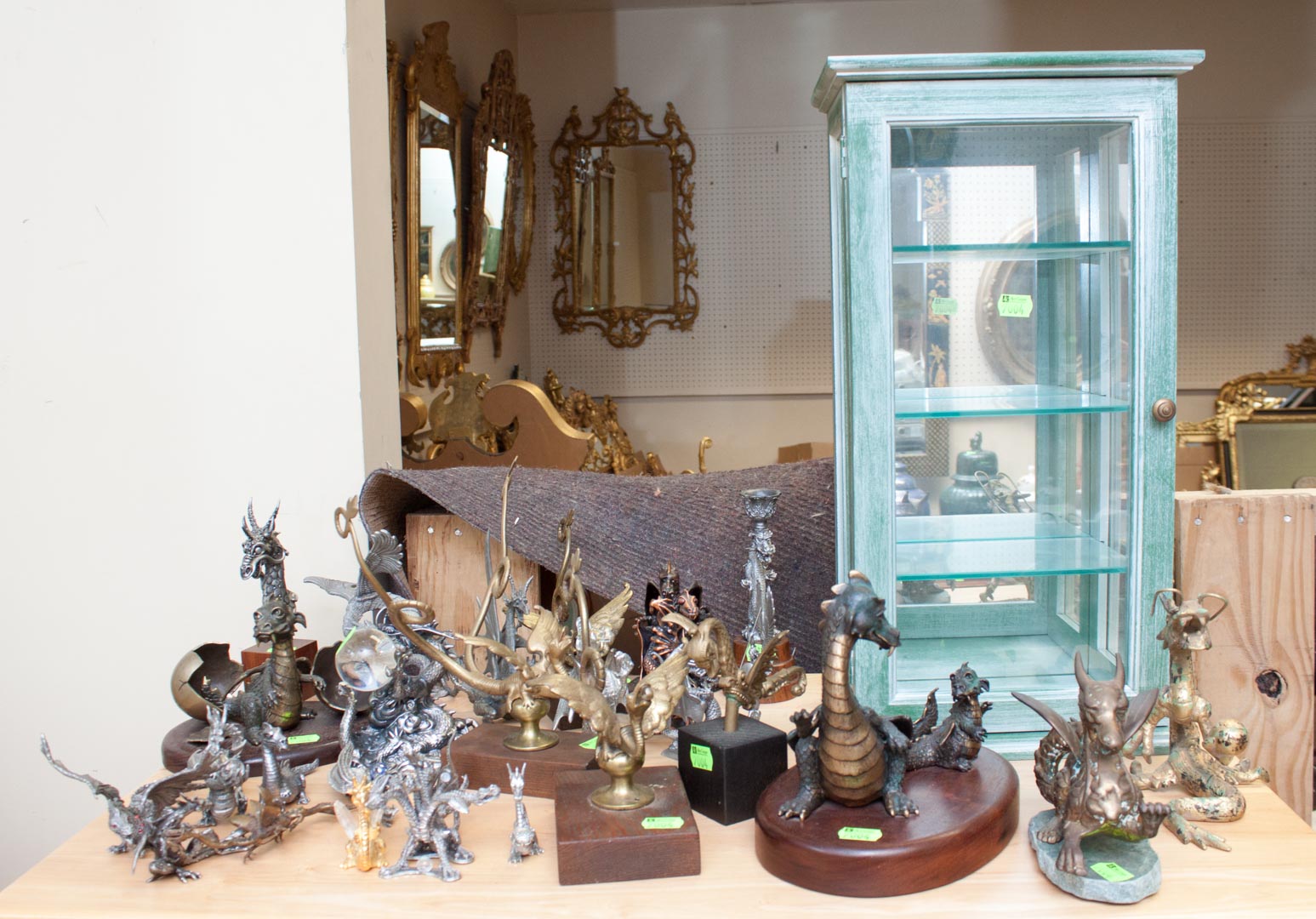 Appraisal: Assortment of decorative dragons with display case