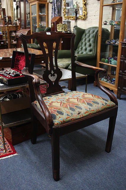 Appraisal: A MAHOGANY CHIPPENDALE STYLE OPEN ARMCHAIR with pierced vase shaped