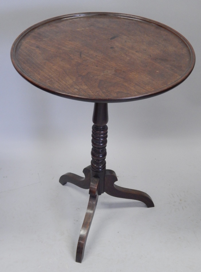 Appraisal: A thC mahogany occasional table the circular dish top on