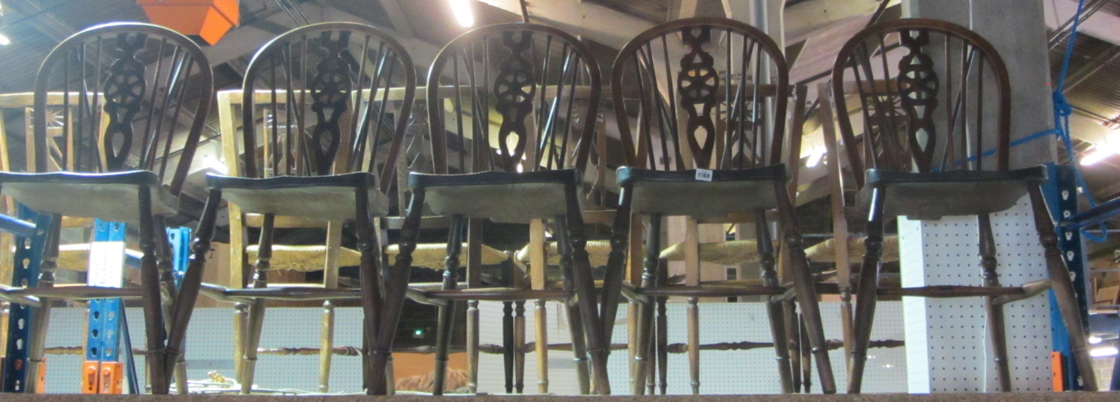 Appraisal: A set of five wheel back scullery chairs