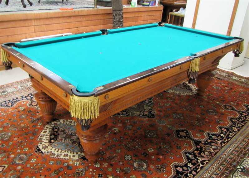 Appraisal: AN ANTIQUE OAK POOL TABLE Brunswick-Balke-Collender Co Improved Union League