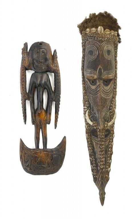 Appraisal: A SEPIK WOOD MASK carved as a long thin highly