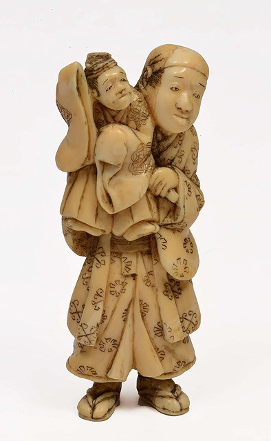 Appraisal: A JAPANESE WALRUS IVORY OKIMONO in the form of a