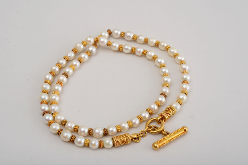 Appraisal: K GOLD AND PEARL TOGGLE NECKLACE Each pearl measuring mm