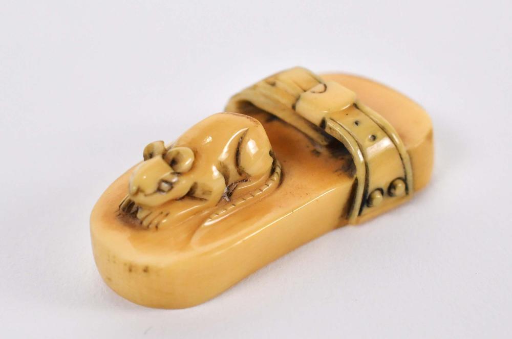 Appraisal: JAPANESE NETSUKE OF A RAT ON A SANDALUnsigned Width in