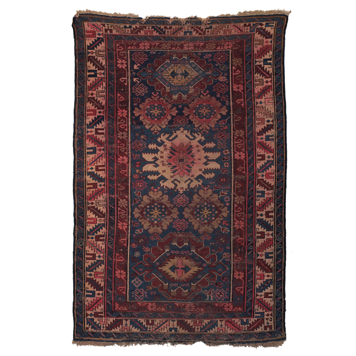 Appraisal: Caucasian rug c stylized floral design on a blue field