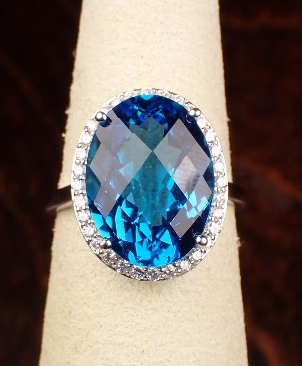 Appraisal: BLUE TOPAZ DIAMOND AND FOURTEEN KARAT GOLD RING The white