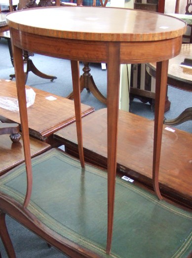 Appraisal: An Edwardian satinwood occasional table the oval top with inlaid