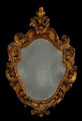 Appraisal: VENETIAN ROCOCO-STYLE CARVED GILTWOOD SMALL MIRROR The cartouche-shape plate within