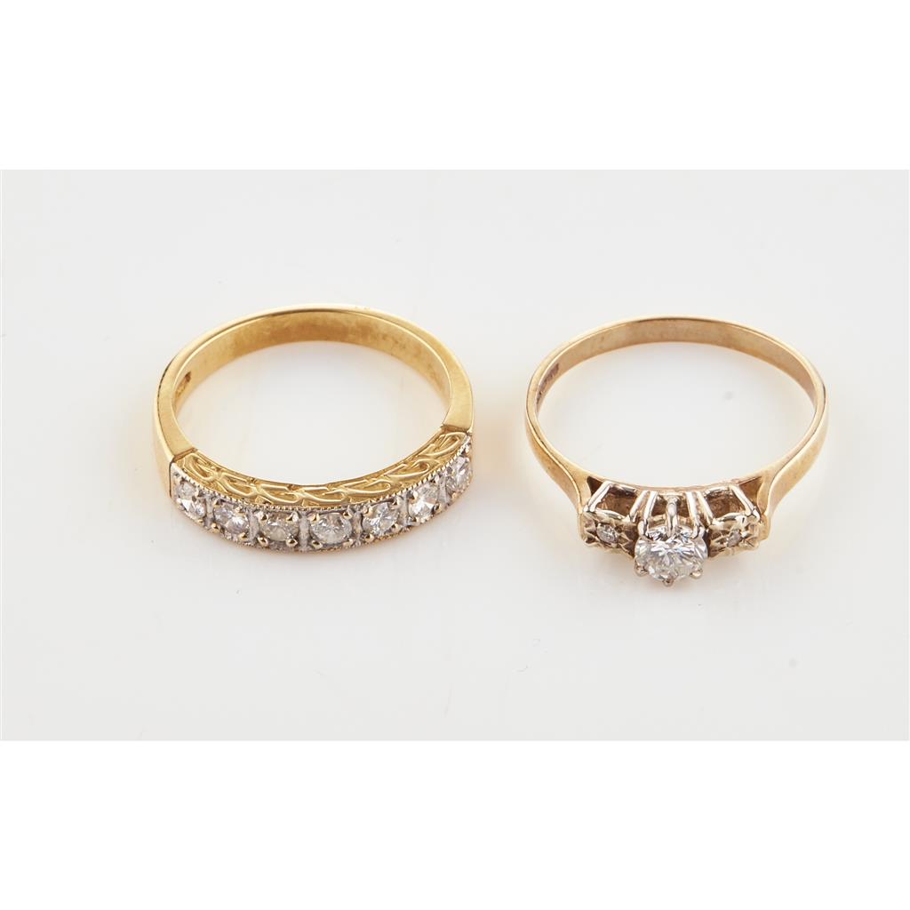 Appraisal: A three stone diamond ring claw set with a single