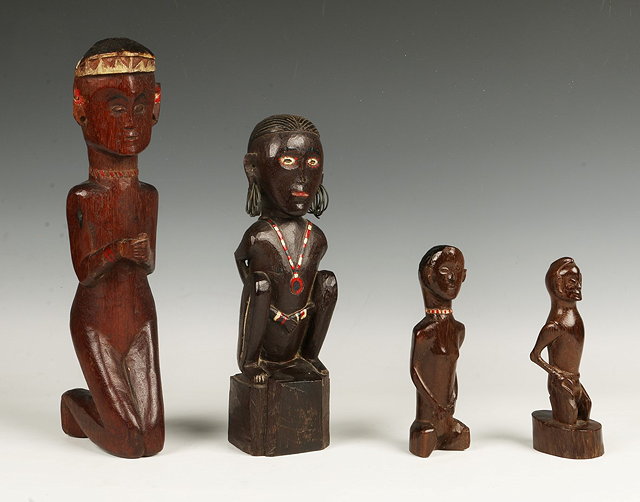 Appraisal: AN OLD SARAWAK CARVED WOODEN FIGURE of a seated human