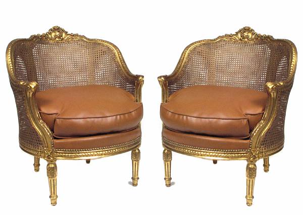 Appraisal: A pair of Louis XV style caned and gilded bergeres