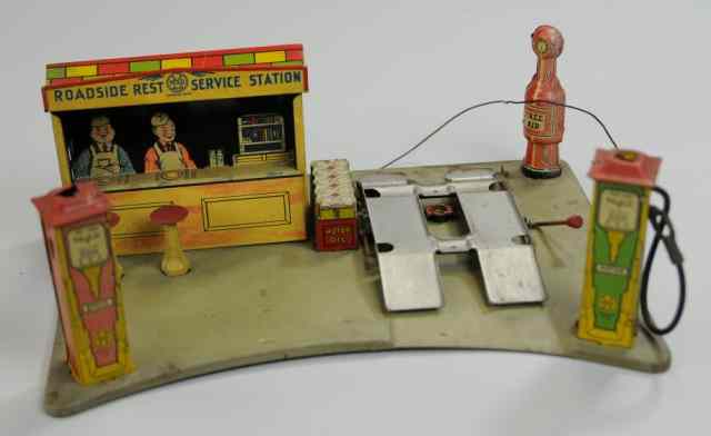 Appraisal: MARX ROADSIDE SERVICE STATION Lithographed tin amusing die-cut images of