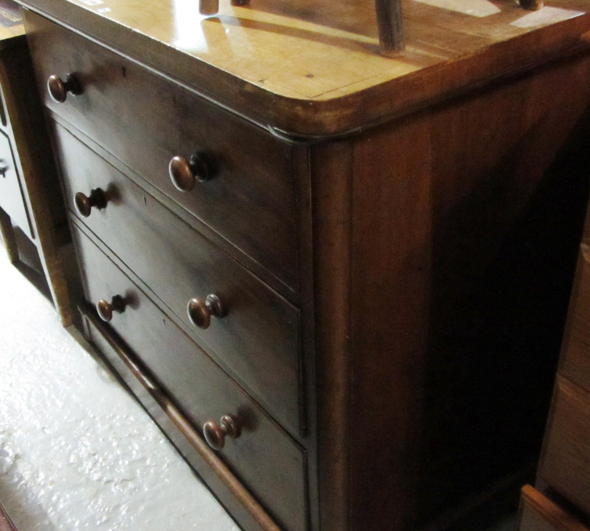 Appraisal: A Victorian mahogany chest of three long drawers