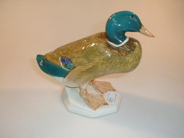 Appraisal: A Beswick mallard duck squatting teal green brown and white