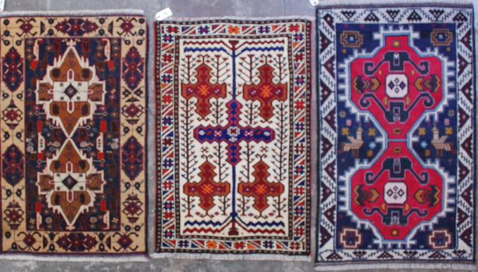 Appraisal: THREE HAND KNOTTED ORIENTAL AREA RUGS Afghan Belouch tribals sizes