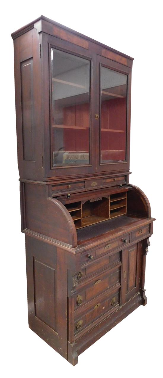 Appraisal: Eastlake two-piece secretary bookcase with cylinder roll top c walnut