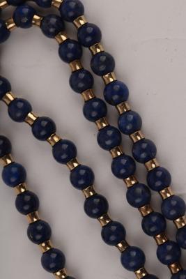 Appraisal: A lapis bead necklace the circular beads with yellow metal