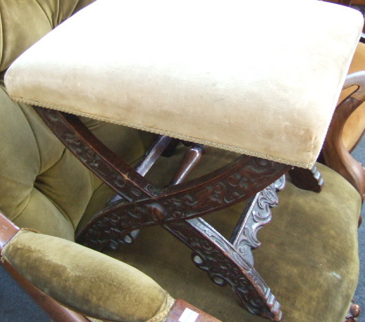 Appraisal: A pair of carved oak and beech 'X' framed stools