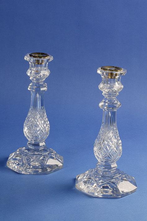 Appraisal: A PAIR OF VICTORIAN CUT GLASS CANDLESTICKS with octagonal rims