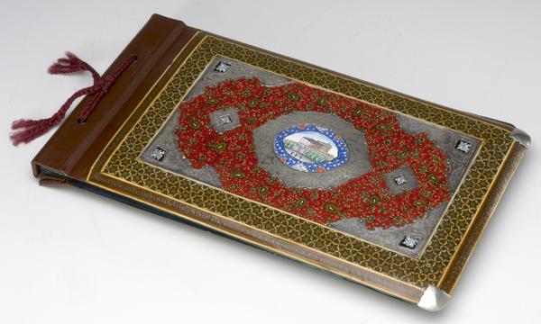 Appraisal: PERSIAN SILVER Scrapbook with lacquered wood covers chased silver mounts