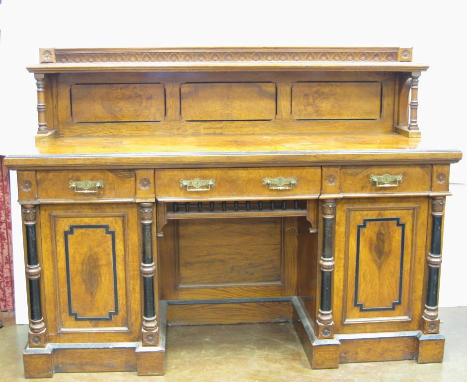 Appraisal: A Victorian Aesthetic Movement pollard oak Sideboard with low raised