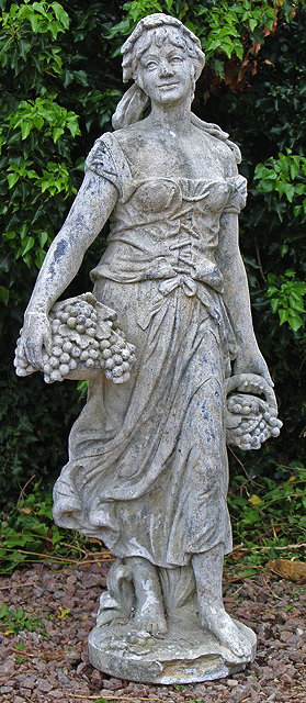 Appraisal: AN OLD FRENCH RECONSTITUTED STONE FEMALE ALLEGORICAL FIGURE representing Autumn