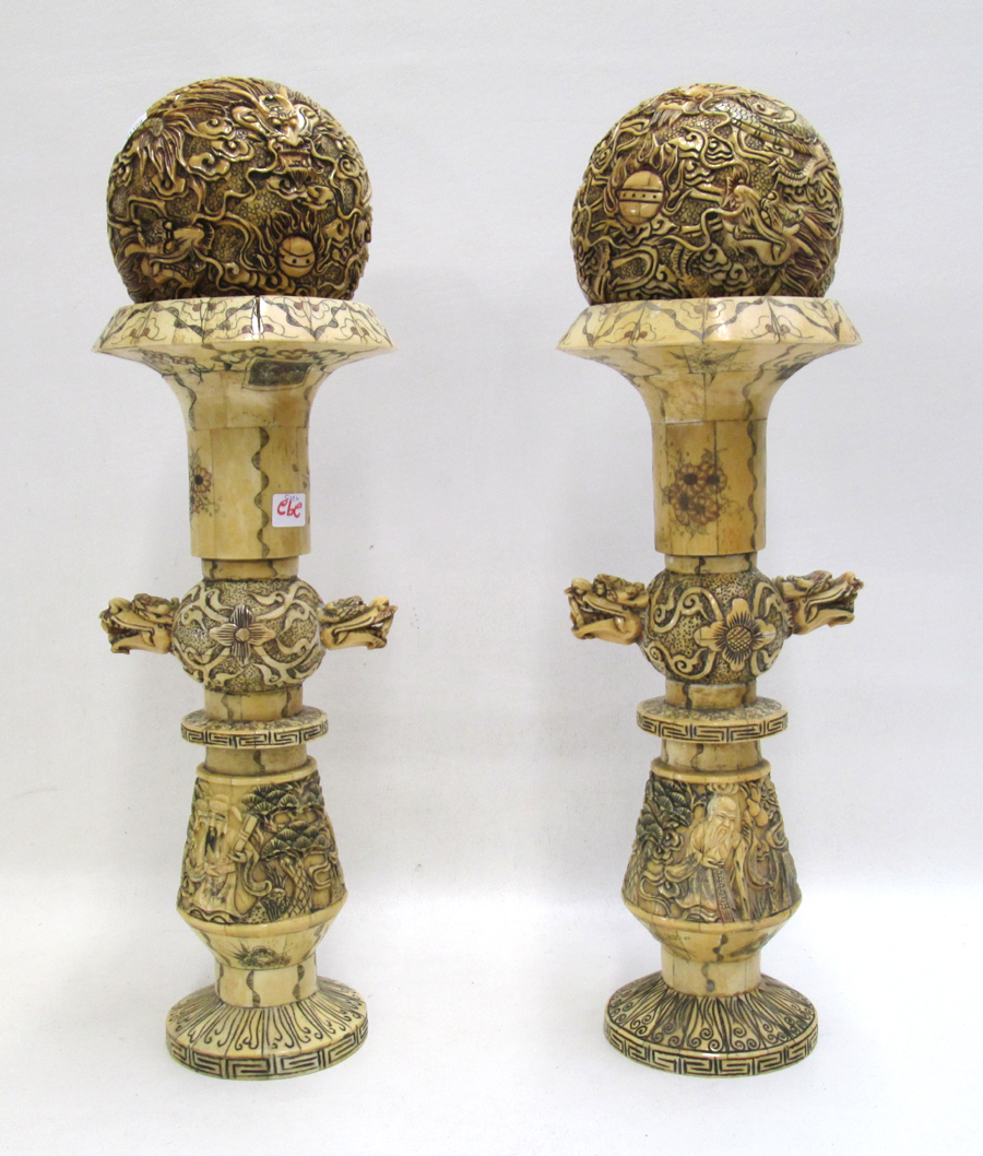 Appraisal: PAIR CHINESE BONE VENEERED BALLS ON STANDS bone tiles on