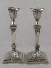 Appraisal: A pair of Victorian silver candlesticks in the Adam style