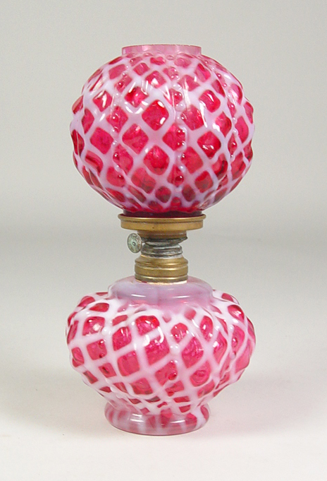 Appraisal: Miniature Cranberry Lattice Oil Lamp Circa late 's Mold-blown base