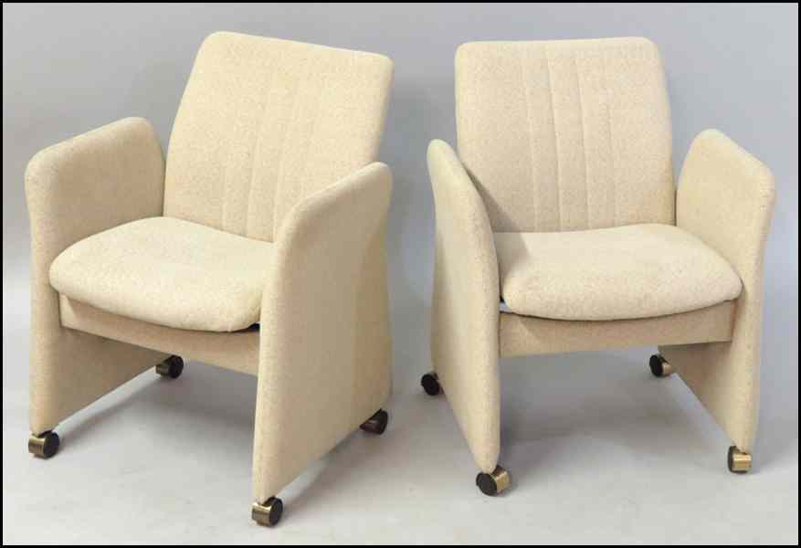 Appraisal: FOUR CONTEMPORARY UPHOLSTERED CHAIRS ON CASTORS With reclining backs Height