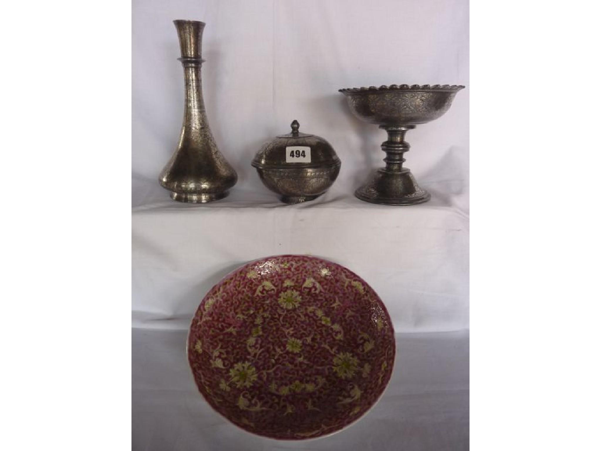 Appraisal: Three Islamic silver inlaid vessels including a bottle shaped vase