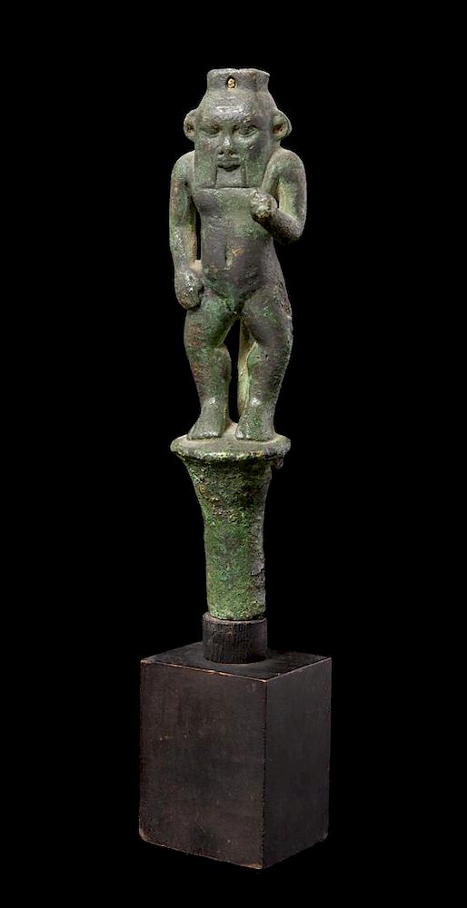 Appraisal: An Egyptian Bronze Bes Standing on a Papyrus Umbel Height