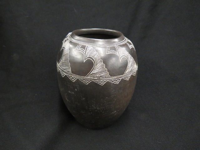 Appraisal: Indian Pottery Vase carved design on black body excellent