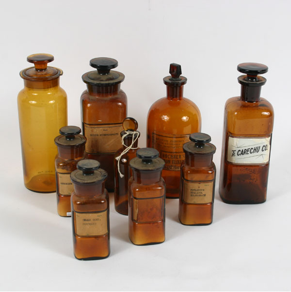 Appraisal: Lot of Amber Pharmacy apothecary bottles with glass stoppers Tallest