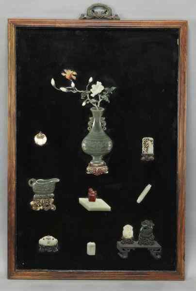 Appraisal: Chinese Qing carved jade mounted screendepicting lucky symbols ''H x