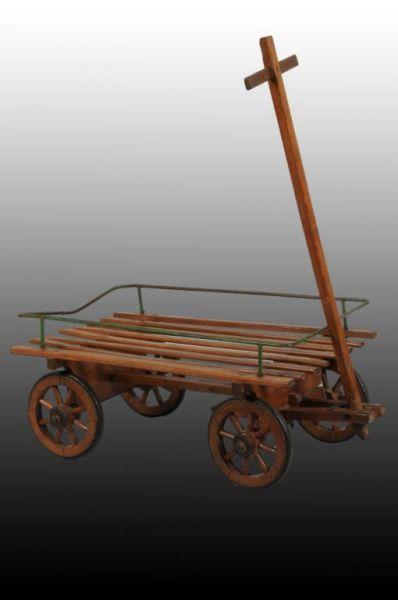 Appraisal: Wooden Wagon Description Wooden wheels and a metal side rail