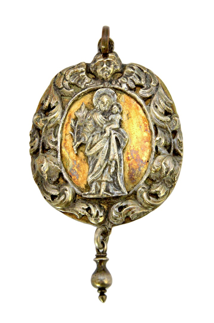 Appraisal: A European parcel gilt devotional pendant of oval form with