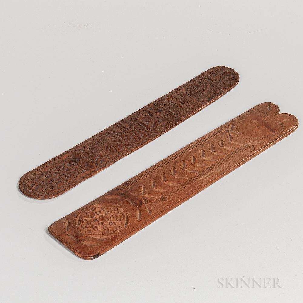 Appraisal: Two Chip-carved Wooden Busks Two Chip-carved Wooden Busks th century