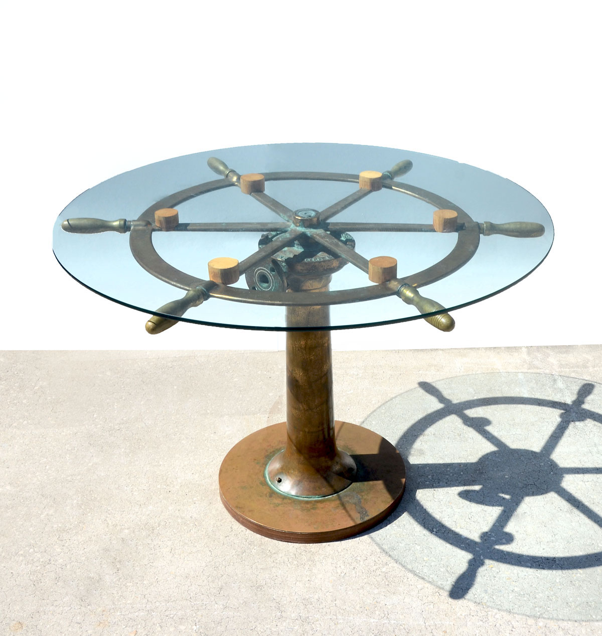 Appraisal: BRONZE SHIPS WHEEL TABLE Bronze Ships Wheel mounted on bronze