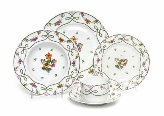 Appraisal: A Partial French Porcelain Dinner Service Limoges comprising dinner plates