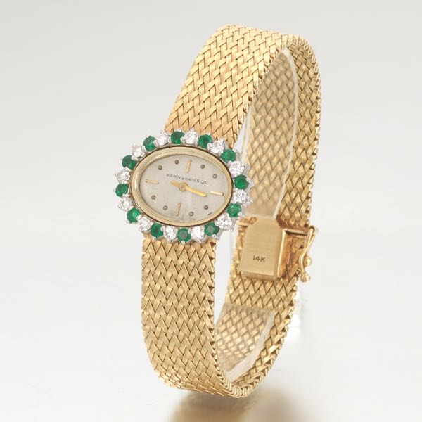 Appraisal: LADIES' GOLD EMERALD AND DIAMOND DRESS WATCH CONCORD WATCH CO