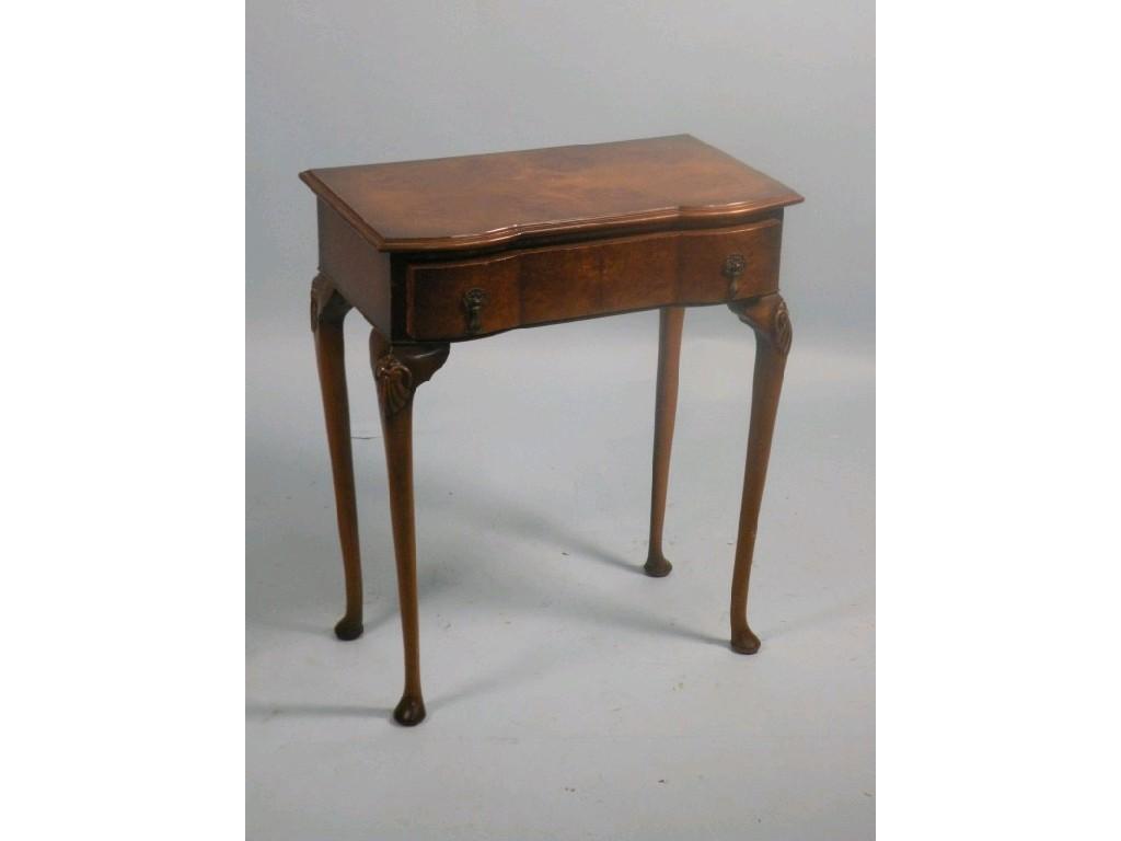 Appraisal: A reproduction burr walnut side table with a frieze drawer