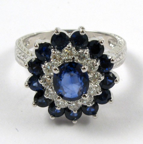 Appraisal: SAPPHIRE AND FOURTEEN KARAT GOLD RING Round-cut blue sapphires and