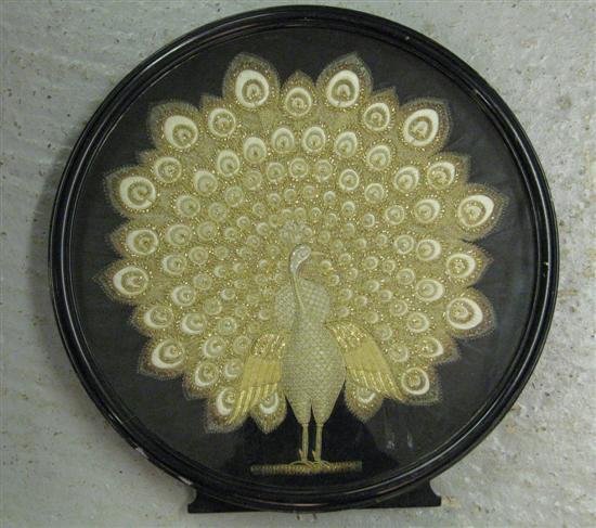 Appraisal: Early twentieth century Indian needle work peacock diameter