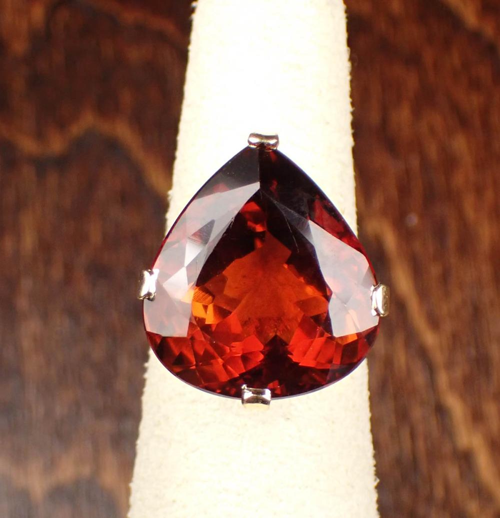 Appraisal: HONEY RED TOPAZ AND FOURTEEN KARAT GOLD RING The yellow