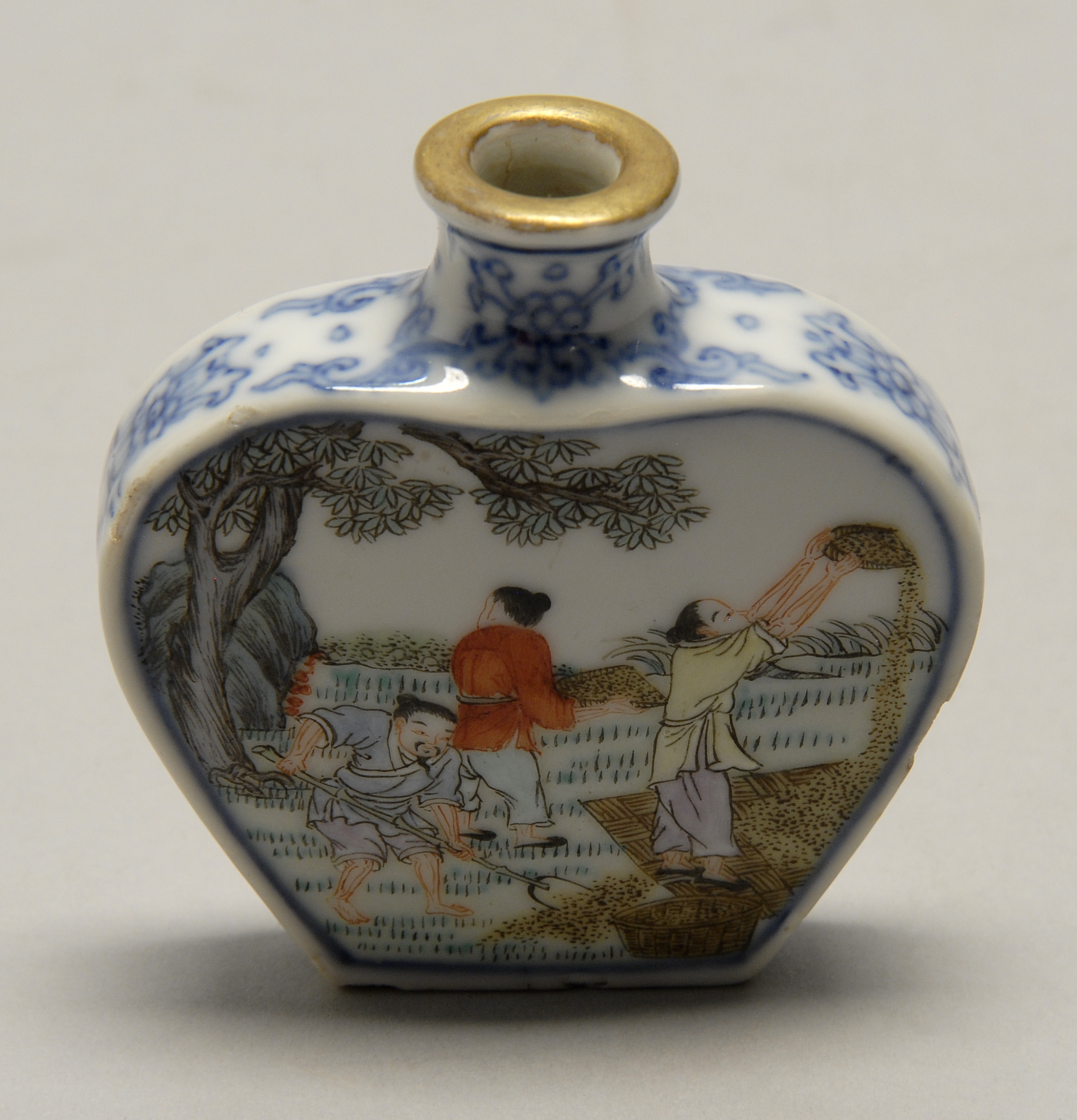 Appraisal: POLYCHROME PORCELAIN SNUFF BOTTLE In flattened ovoid form with figural